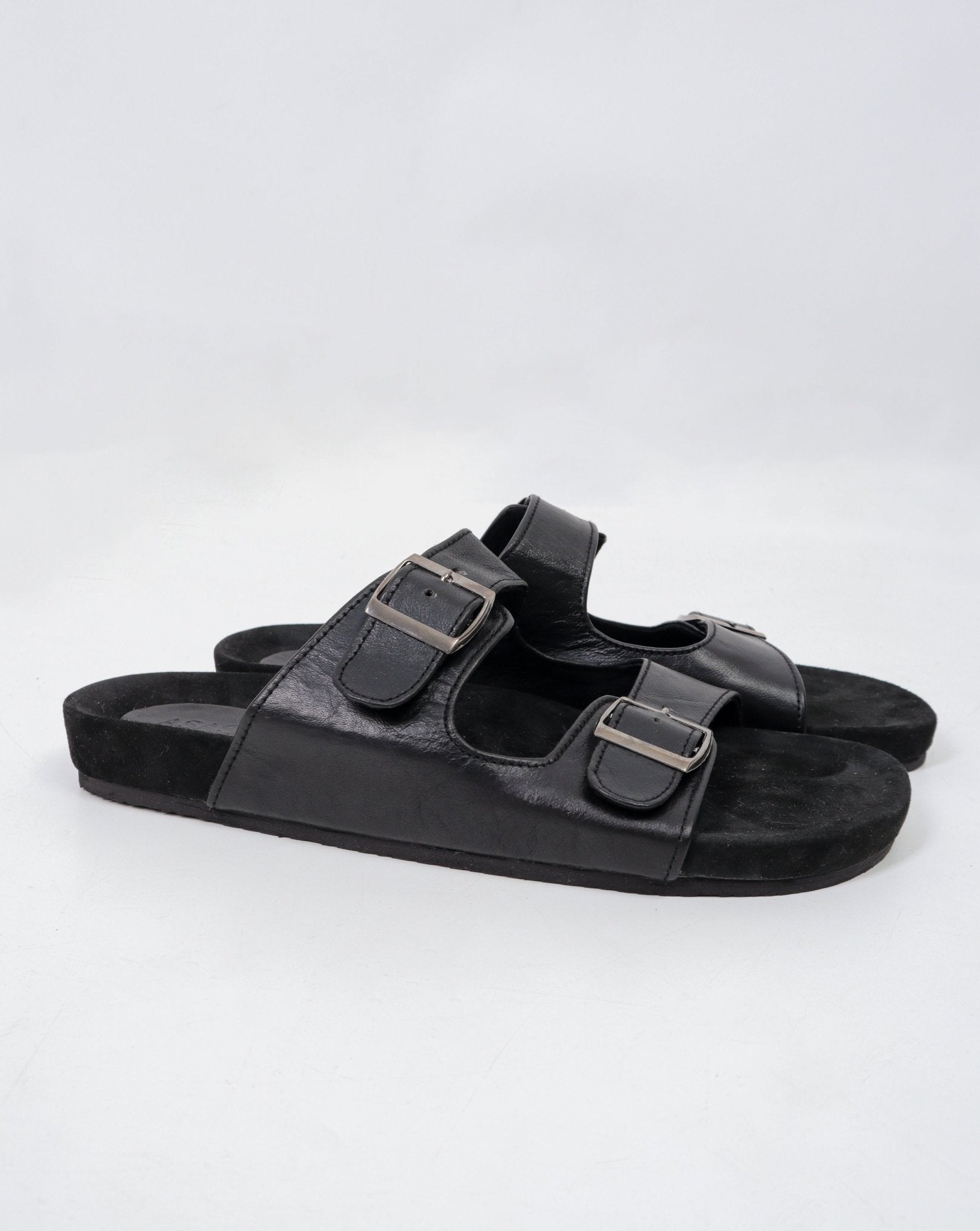 alt="Front view black Raven double strap sandals, open-toe design with buckle accents."