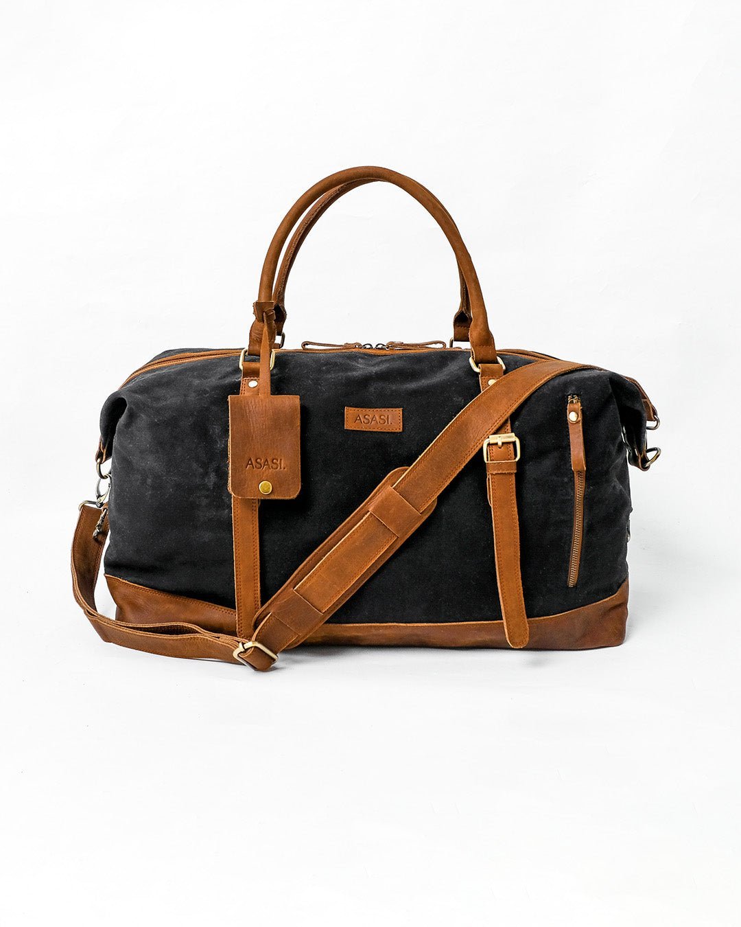 alt="Front view Marshal tan leather duffle, roomy interior with zip closure."