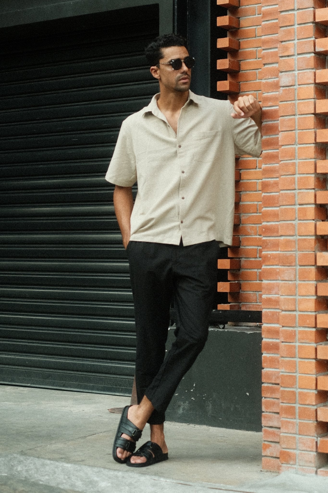 alt="Black linen pants, breathable relaxed-fit with elastic waist and cropped hem, front view."