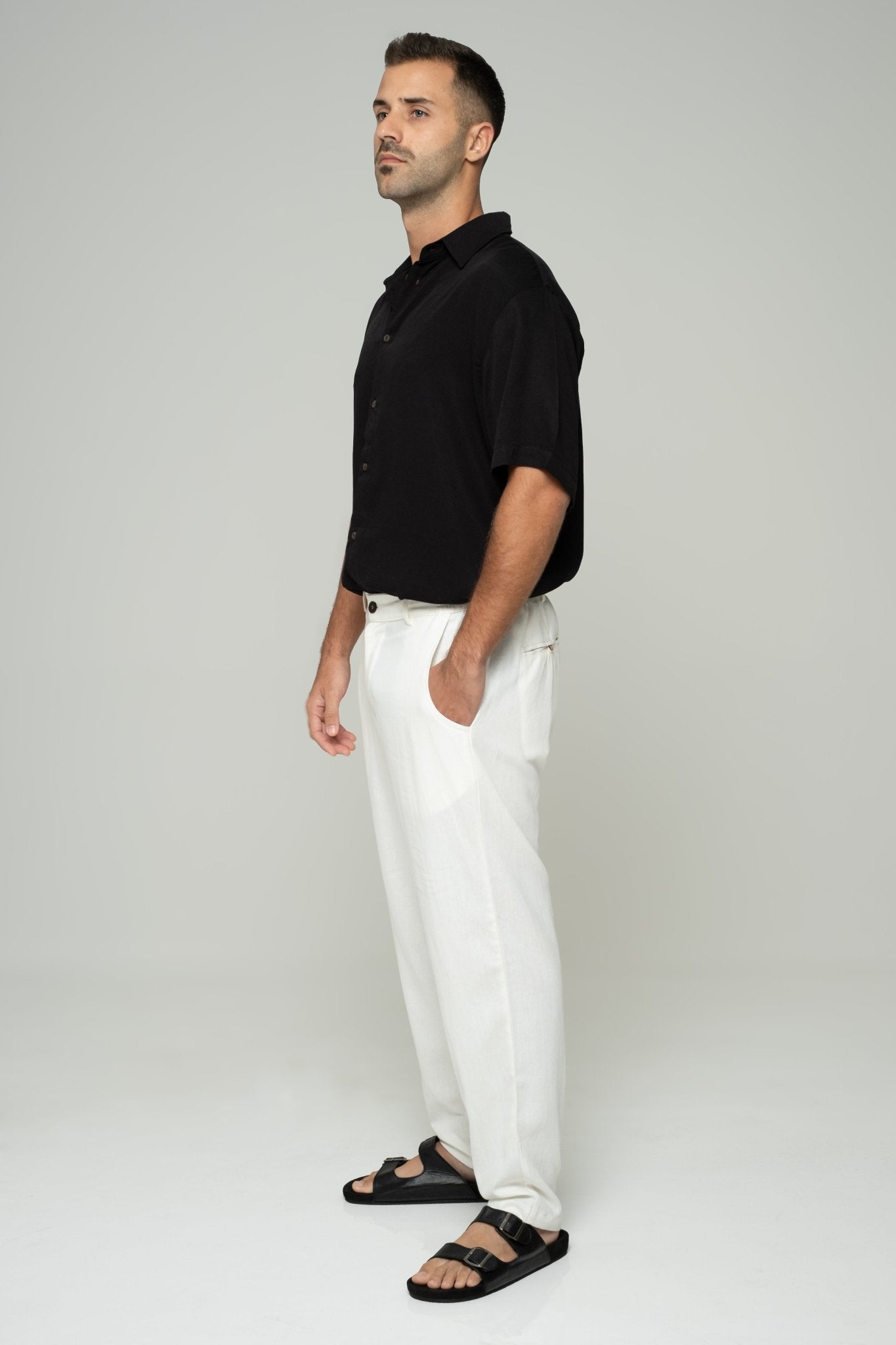 alt="Side profile bone linen pants, wide leg, breathable cotton-linen blend."