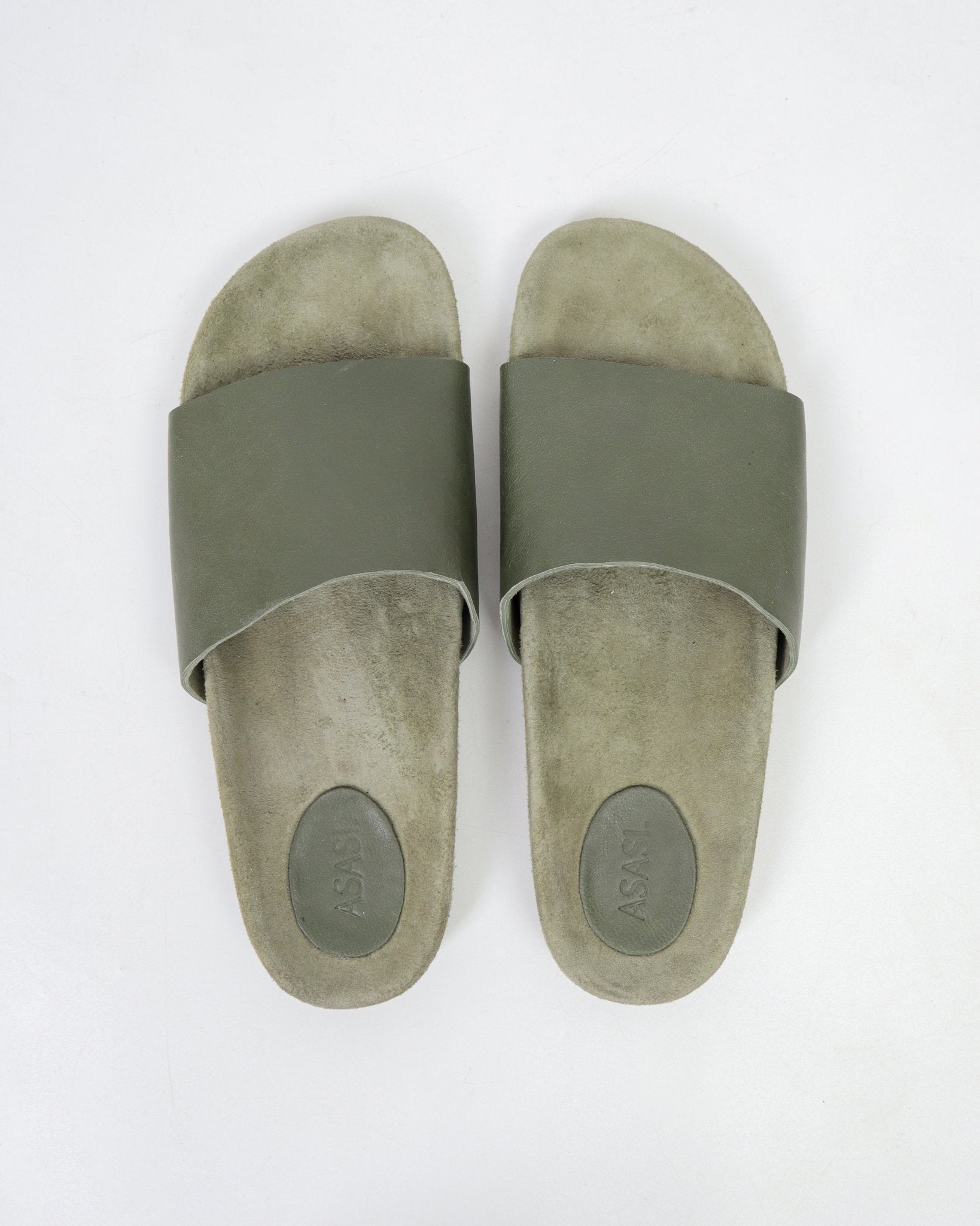 alt="Noble leather slides in olive green, slide-on sandal with cushioned footbed, top view."