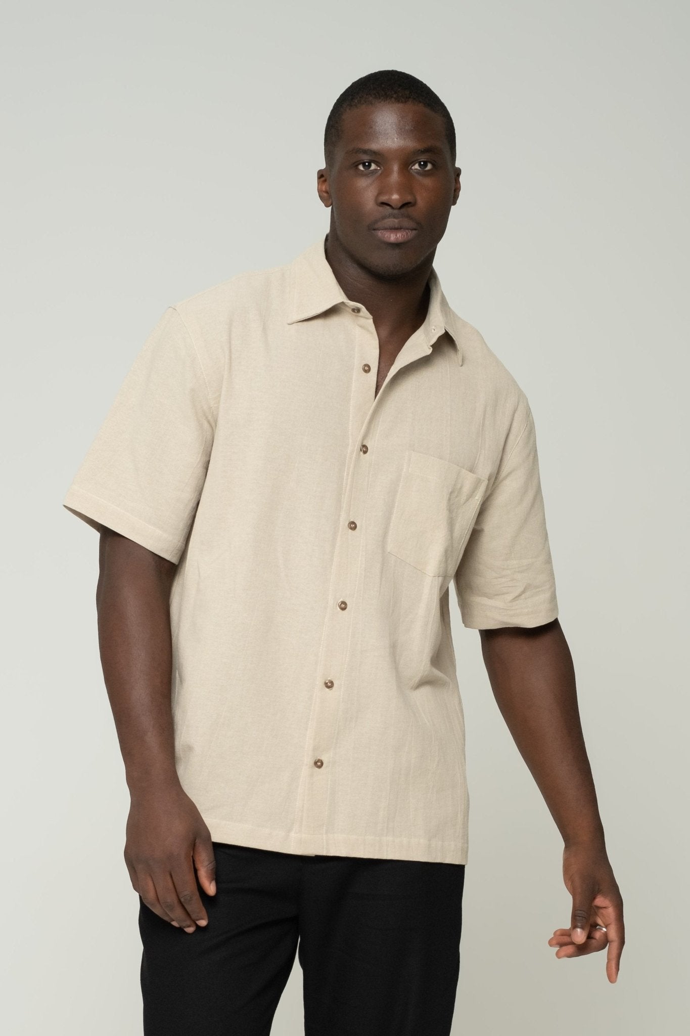 alt="Hearthstone origin short-sleeve shirt in warm beige, breathable cotton, front view."