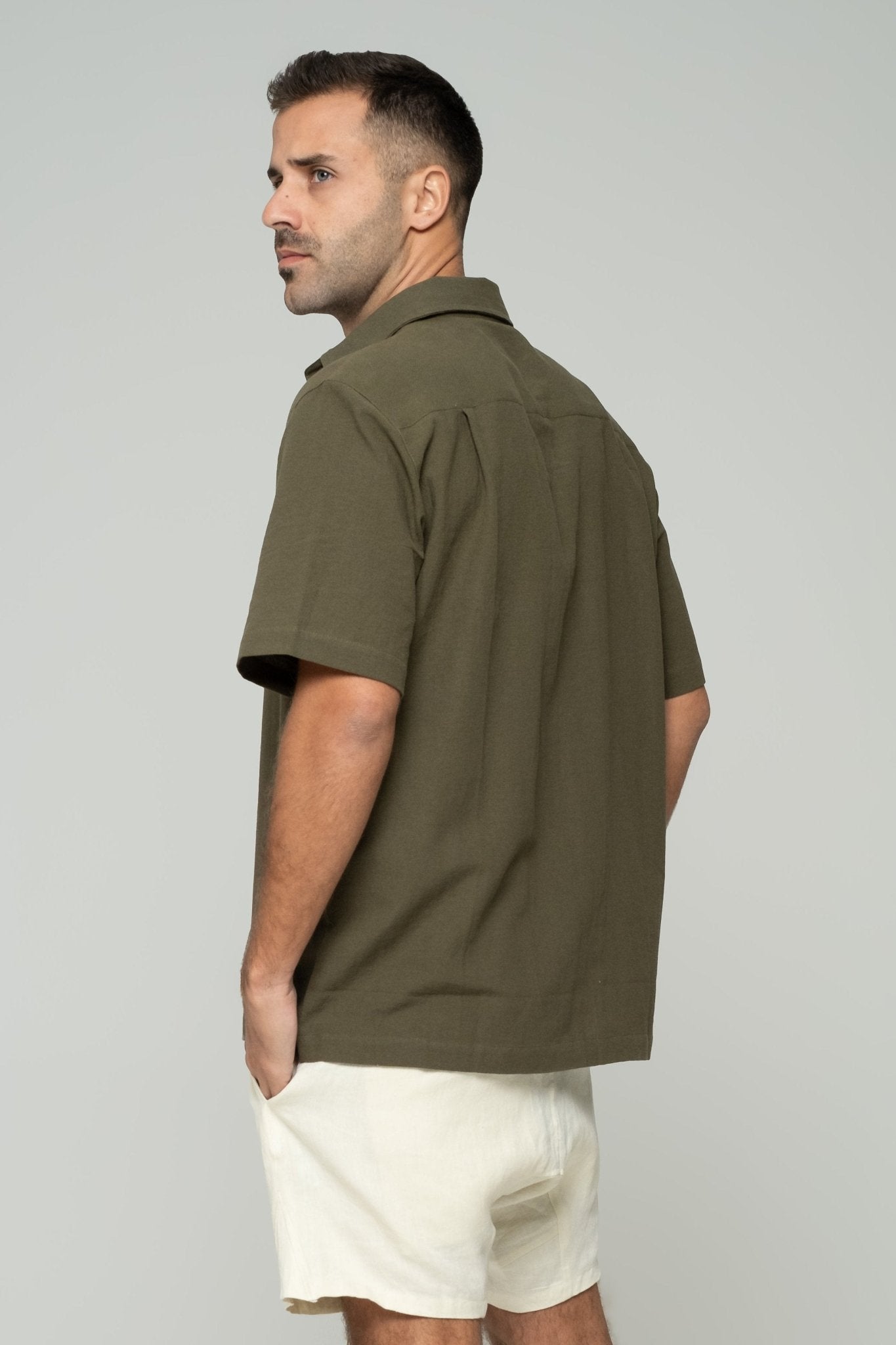 alt="Side view Sierra olive Origin short-sleeve shirt, straight hem and sleeve detail."