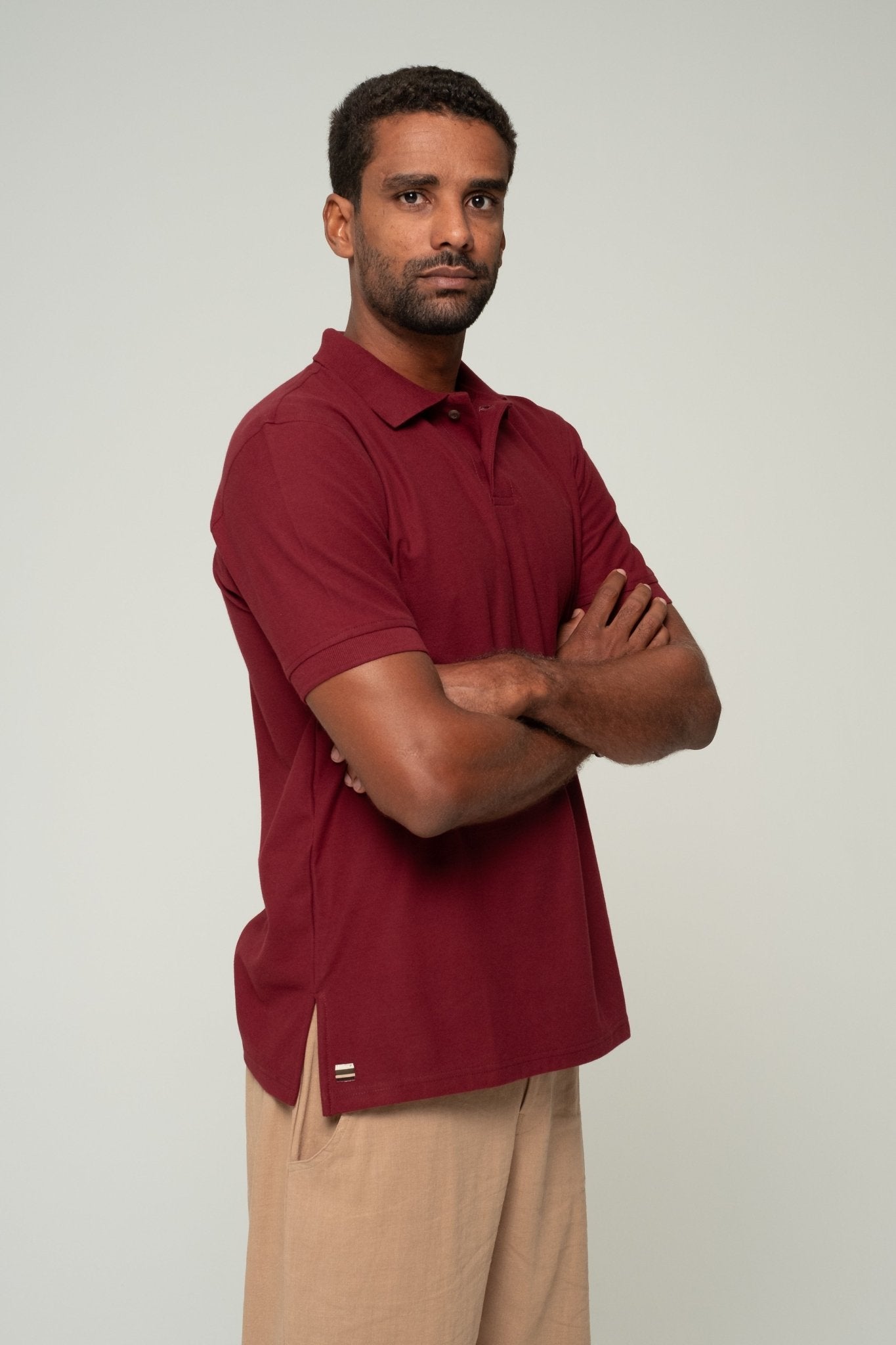 alt="Front view deep merlot ASASI polo shirt in breathable cotton pique, refined staple for menswear."