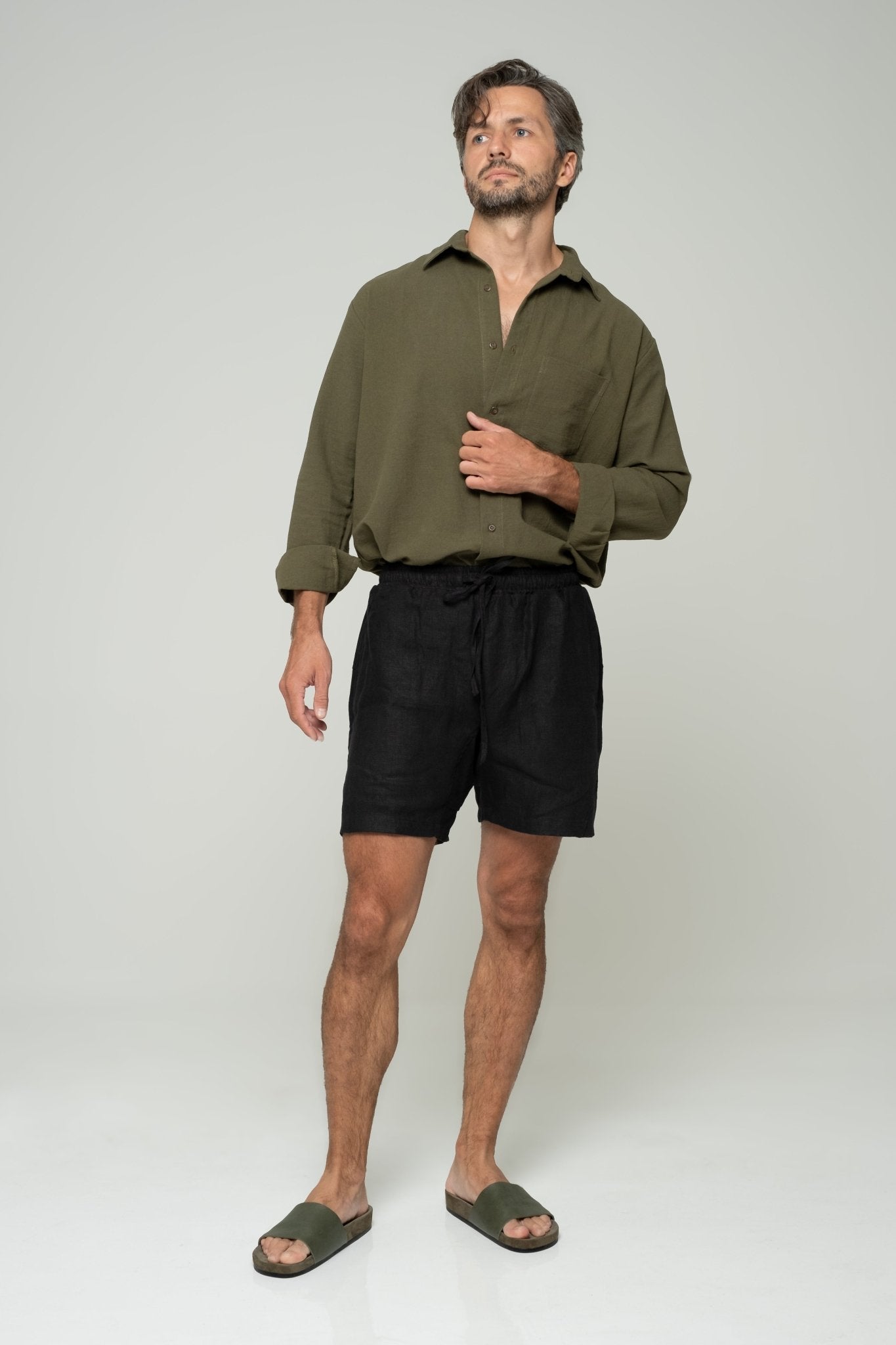 alt="Front view black Double Black shorts, relaxed casual fit."