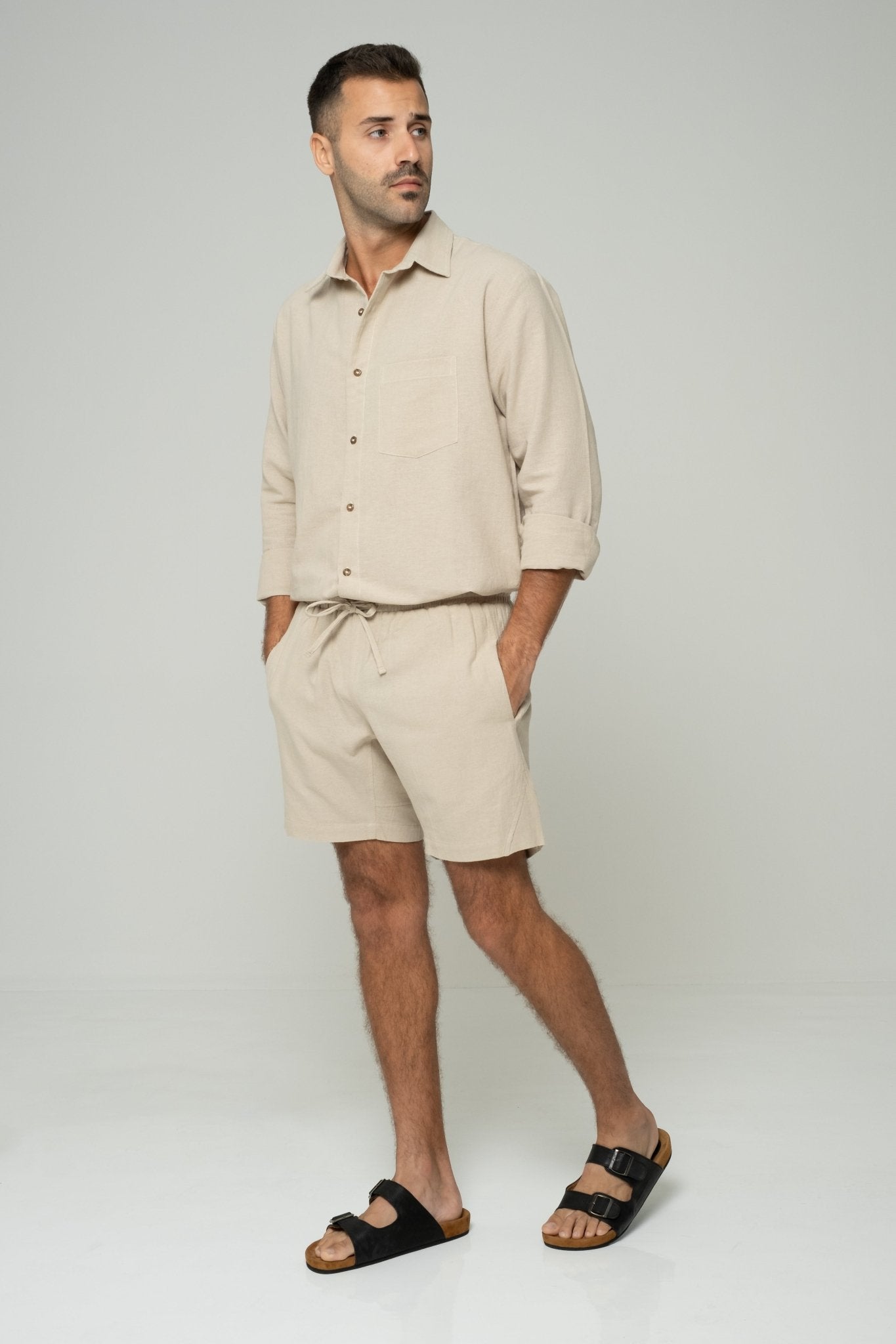 alt="Hearthstone beige shorts, mid-length cotton blend with drawstring waistband."
