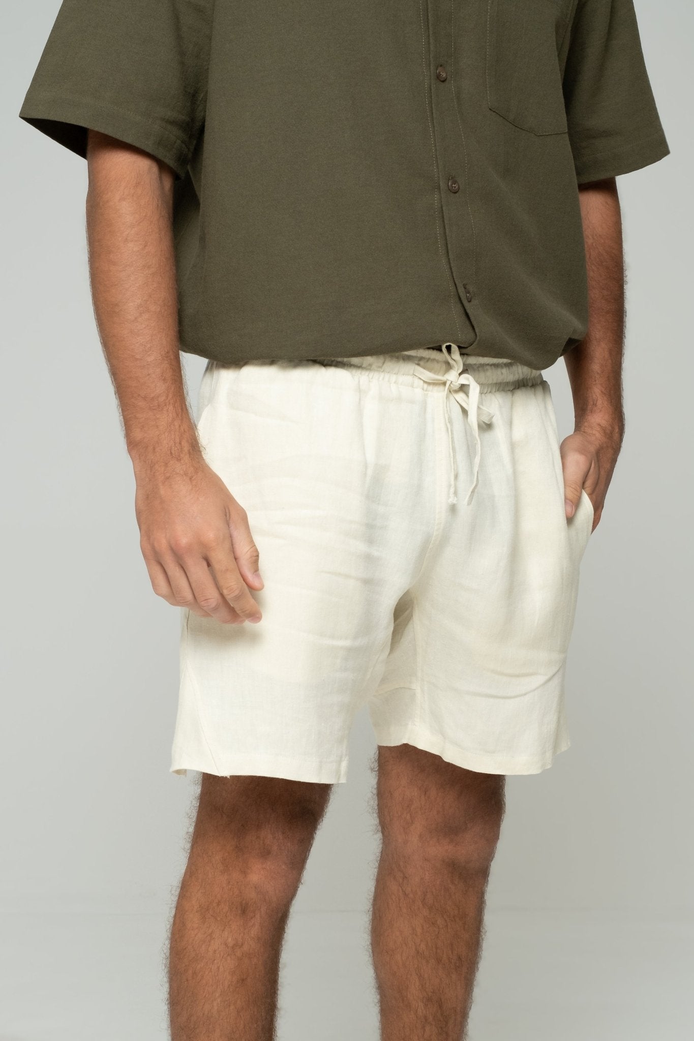 alt="Front view Marrow off-white shorts, relaxed fit cotton blend with functional side pockets."