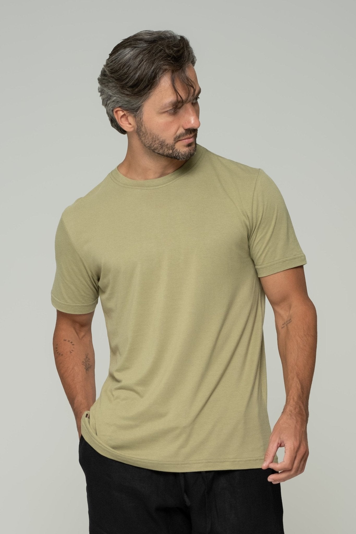 alt="Vāyu classic fit t‑shirt in olive green, soft bamboo-cotton blend crew-neck."